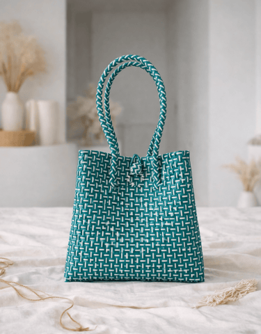 Handwoven green striped plastic tote bag handmade from recycled materials by Indonesian artisans