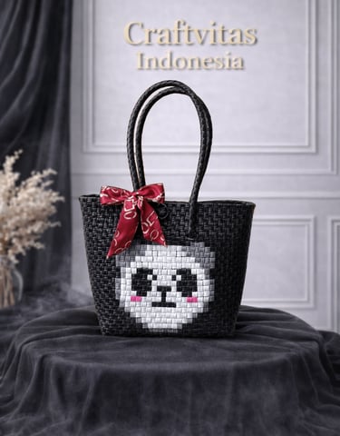 Cute black handwoven plastic tote bag with character pattern, handmade recycled plastic bag