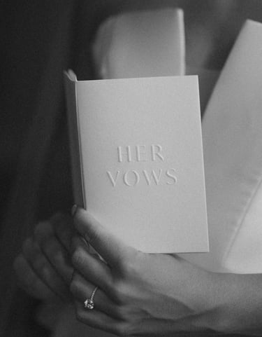 a woman holding a book with her hands in her hands