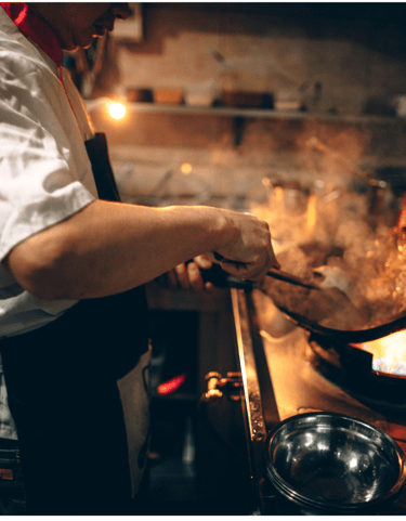 cook preparing delicious catering meals