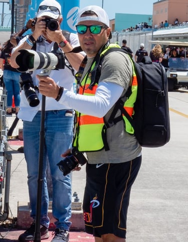 a man taking a picture of a camera