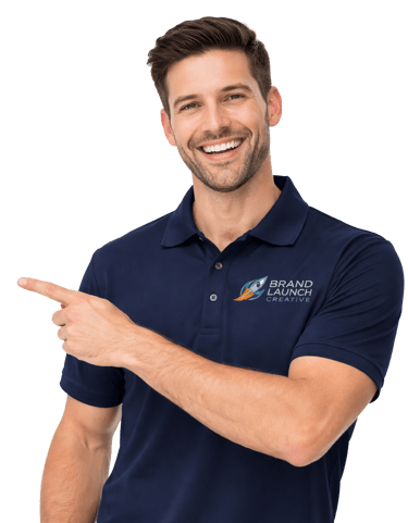 Smiling man in a navy Brand Launch Creative polo shirt pointing to his right.