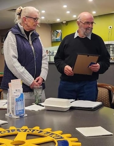 Rebecca Williams awaits receipt of her New Member Pack from President Doug Mitchell
