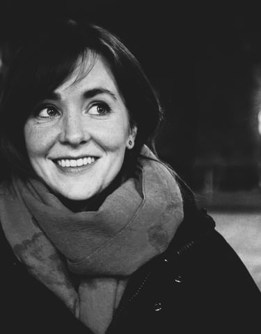 A black and white portrait of the poet Alvy Carragher