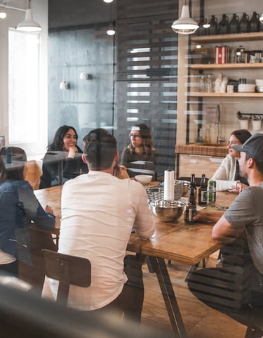 a group of people sitting at a table