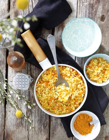 a bowl of food with a spoon and a spoon in it