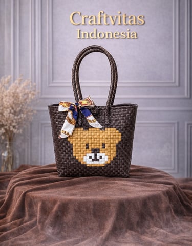 Brown handwoven plastic tote bag with bear character design, handmade sustainable tote bag