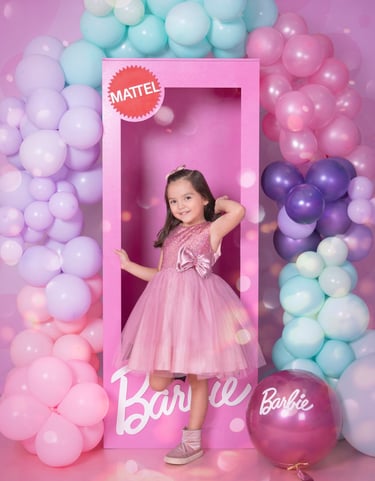 a little girl in a pink dress and a pink dress