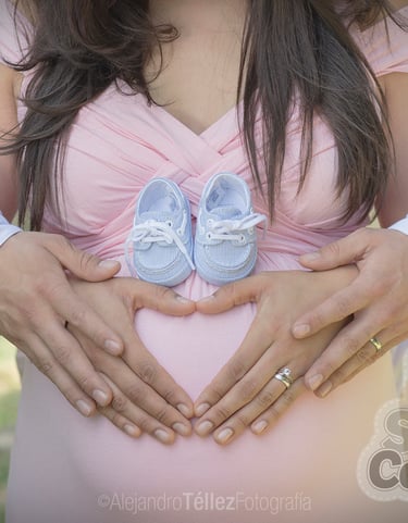 a pregnant woman holding her belly in her belly