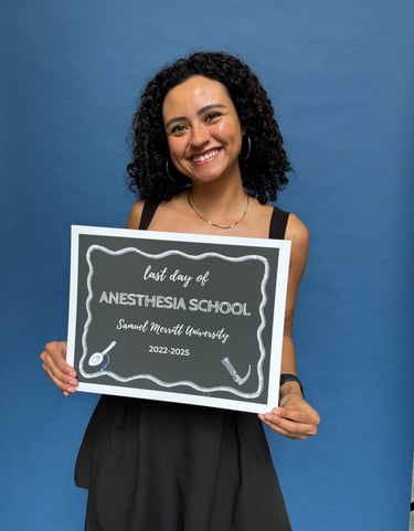 “Classic stand-alone photo booth with guest posing and smiling at a Graduation
