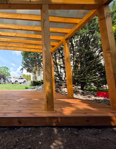 a wooden deck with a pool and a pool