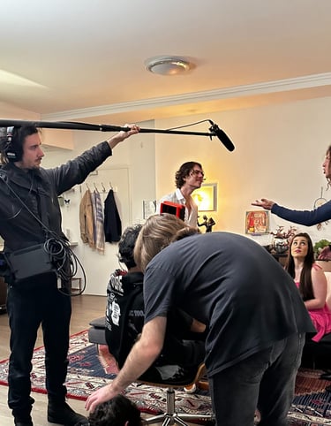a man is filming a video camera and another is filming a video