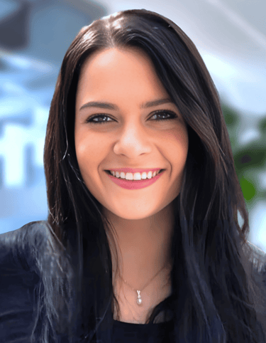 a woman with long hair and a black top