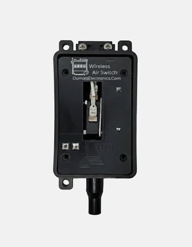 Black wireless air switch by Dumais Electronics showing internal circuit board components and wiring.