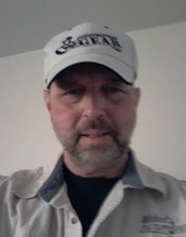 a man in a white shirt and a white hat