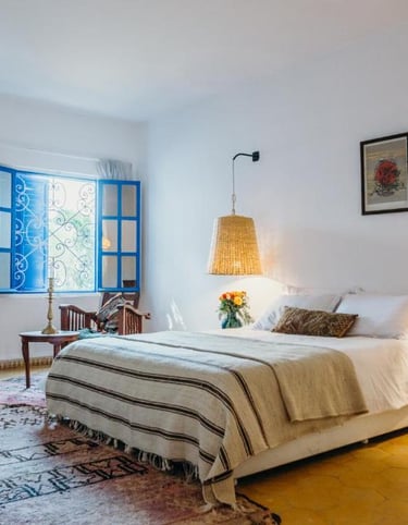 a bedroom with a bed and a fireplace