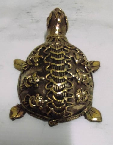 "Handcrafted brass turtle with engraved floral design–Vastu and home decor piece-Prepared for export"