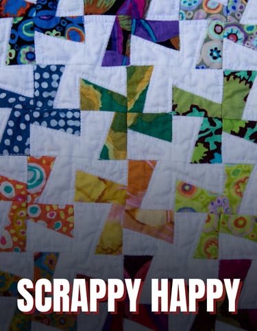 a colorful quilt with white windmills