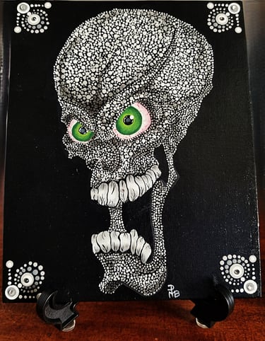 A screaming skull, green eyes, black background.