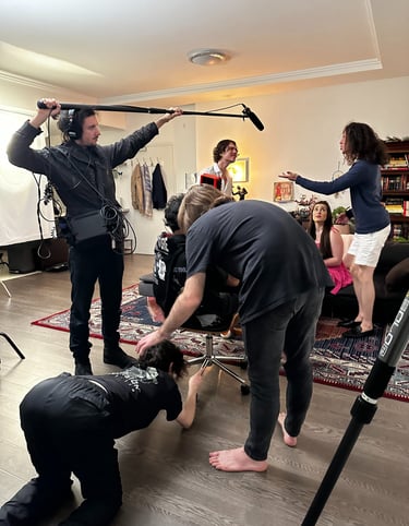 a man is filming a video camera and another is filming a video