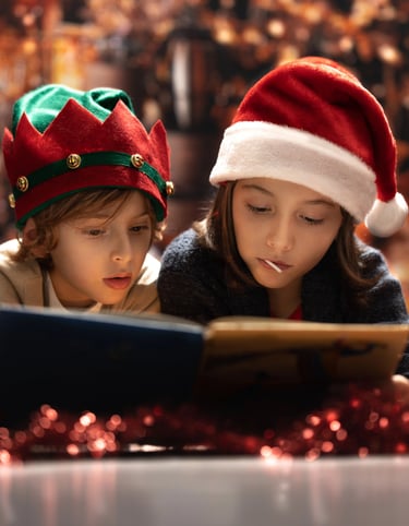 two children in santa hats and santa claus hat