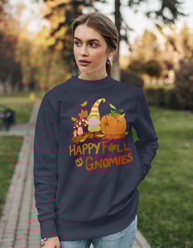 a woman wearing a happy fall sweatshirt that reads happy fall my gnomies with a gnome pumpkin leaves