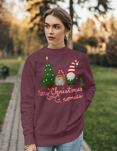 a woman wearing a christmas sweater with a gnome and a hedgehog saying merry Christmas my gnomies