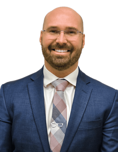 man in a suit with glasses wearing a tie