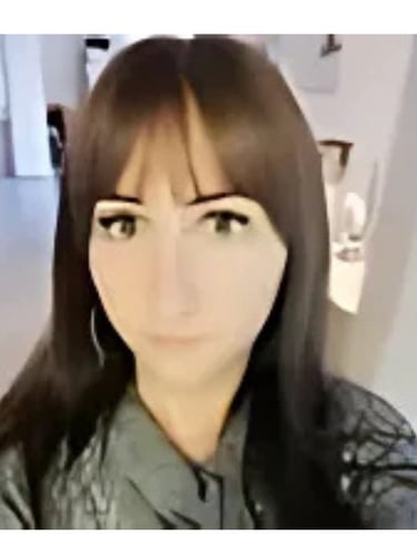 a woman with long hair and a green shirt