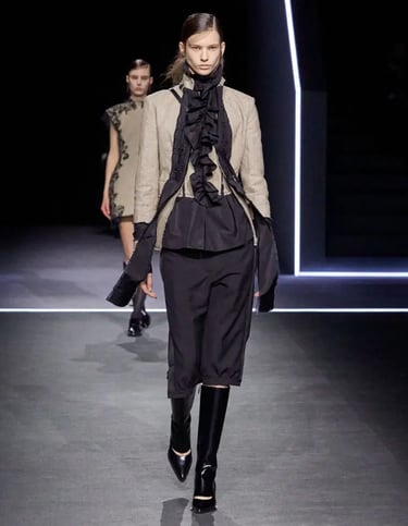 Blazer and ruched top with cropped trousers.