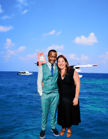 a man and woman standing in front of a plane