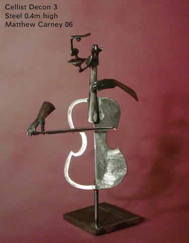 a metal sculpture of a man playing a cello