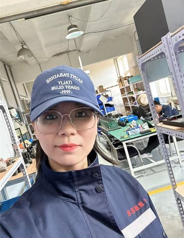 Worker operating right-angle nut runner in Chinese factory