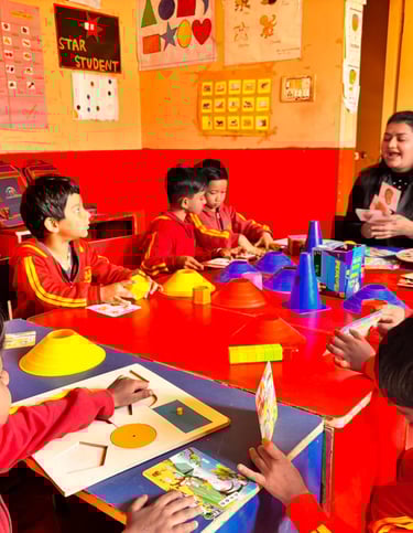 Preschool children and teacher engage in interactive learning activities with educational puzzles and games in a classroom.