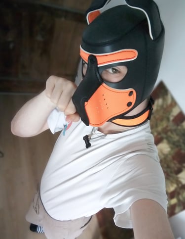 Man poses for a selfie in a pup mask.