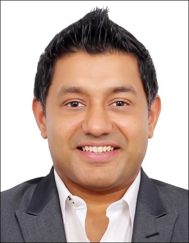 a man in a suit and tie smiling