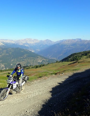 a person on a dirt bike on a dirt road