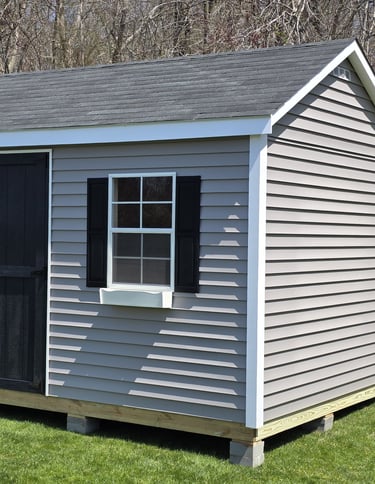 10x16 vinyl storage shed custom built in Pembroke, Massachusetts, low-maintenance outdoor storage.