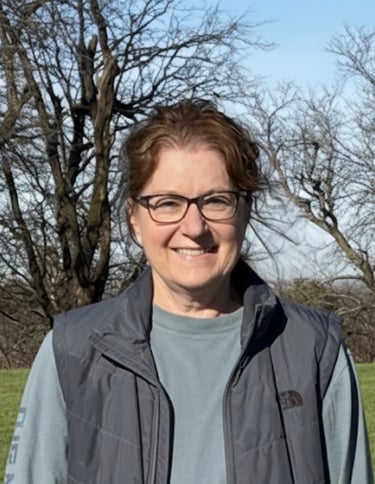 Farm owner standing alone in the field.
