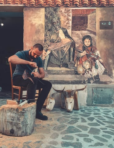 Artisan carving a traditional Boes mask in Ottana, Sardinia