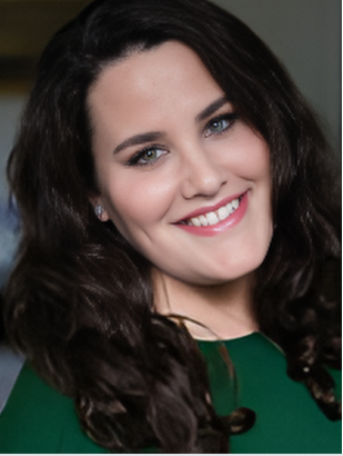 a woman with long hair and a green dress