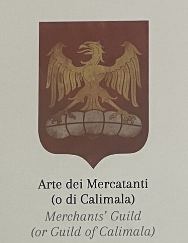 a medieval guild emblem with an eagle on a bale of cloth