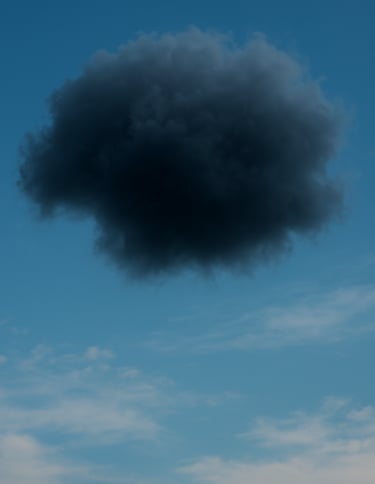 A dark storm cloud in a blue sky