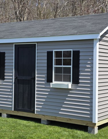 10x16 vinyl storage shed custom built in Pembroke, Massachusetts, low-maintenance outdoor storage.