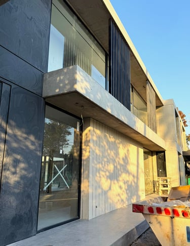 a skateboarder is riding down a ramp in the city