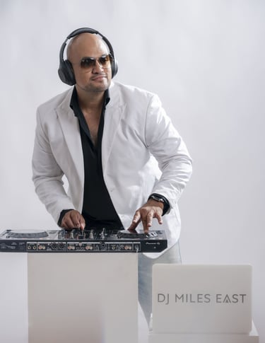 a dj in a white jacket and headphones