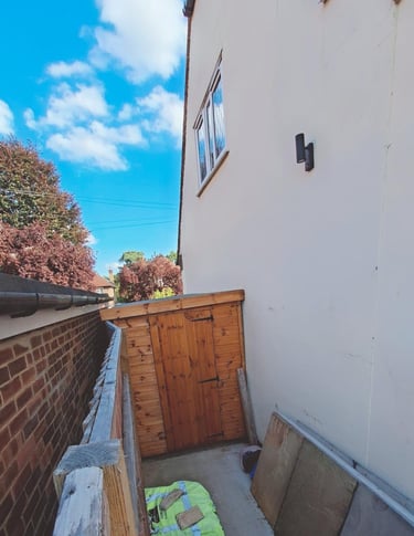 www.truthincontext.co.uk Rosa and Murray Bell's new 2025 shed pushing over Myers 2023 boundary fence