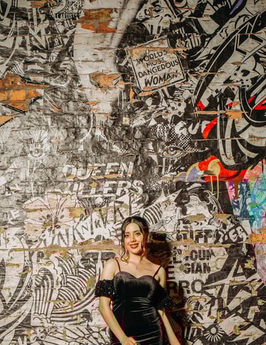 Bride posing by a colorful graffiti wall in York’s vibrant streets, captured by Fred Art Studio.