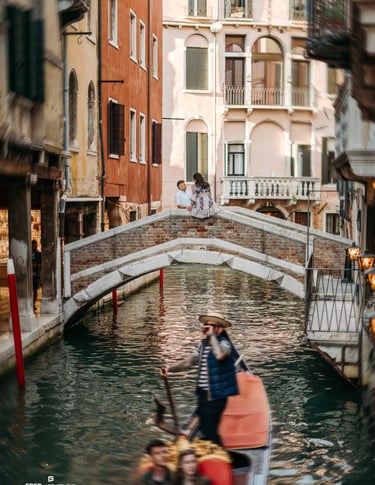 Couple on bridge over Venice canal