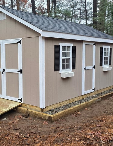 Custom 10x16 wooden shed built in Hingham, Massachusetts for versatile outdoor storage.